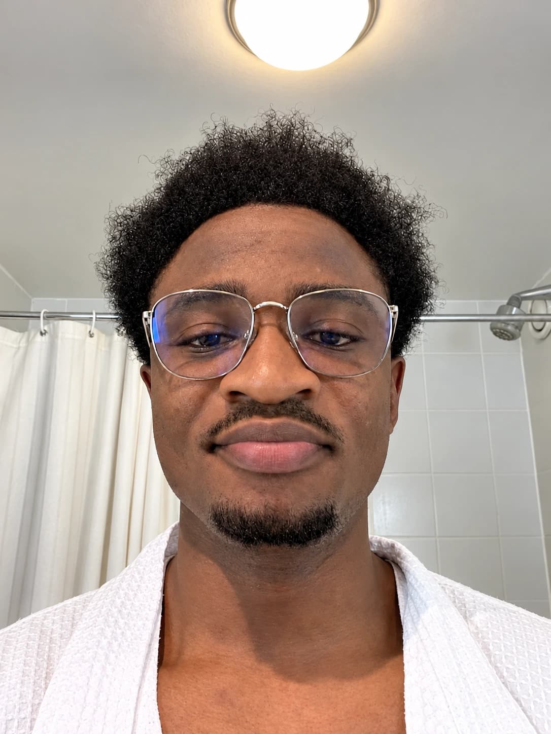 Francis wearing glasses, a candid close-up
